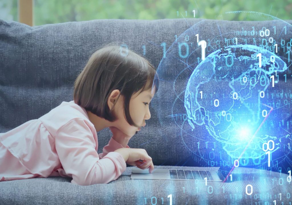 Asian little girl using laptop PC. Education technology. EdTech.